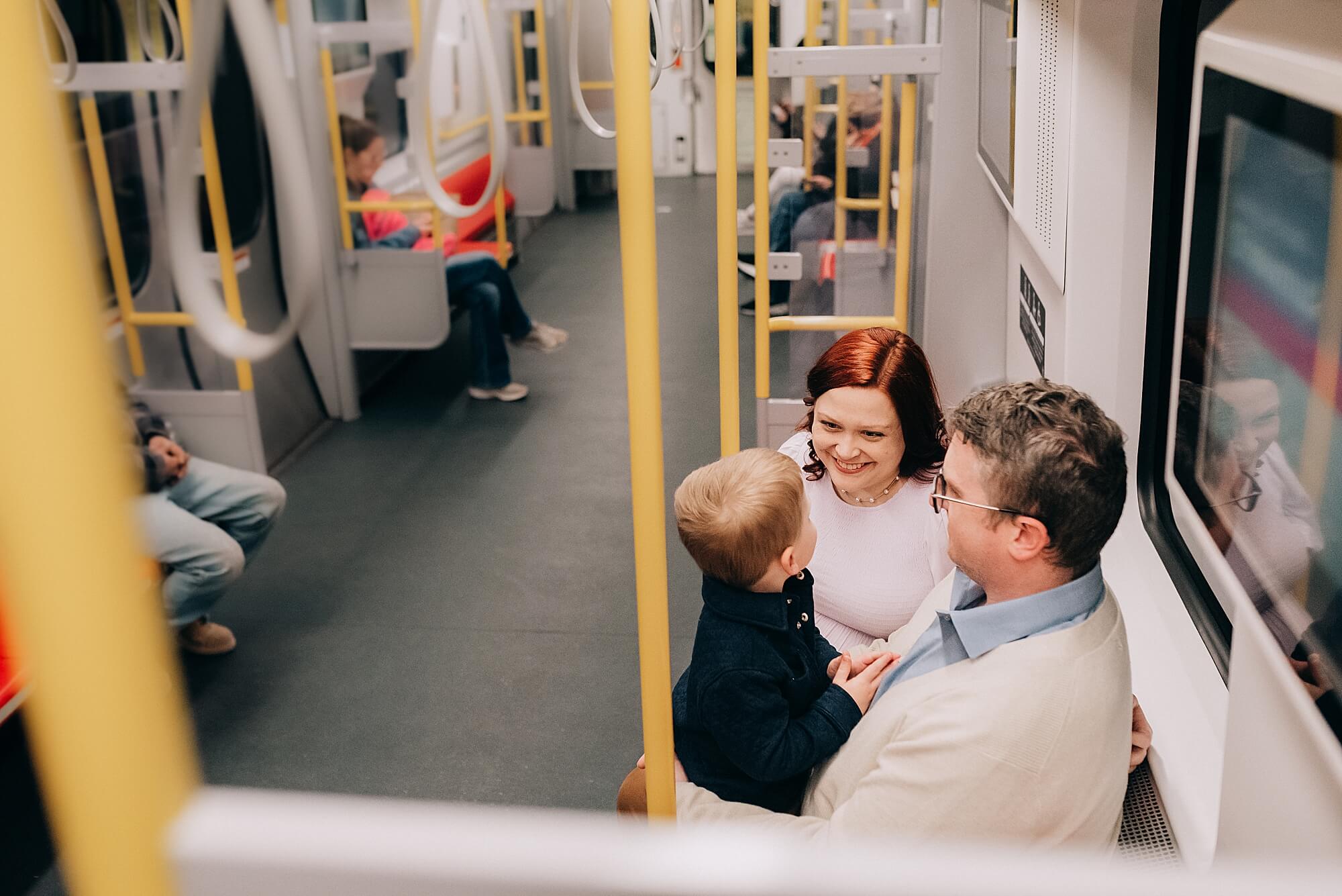 A young family rides the subway in Boston