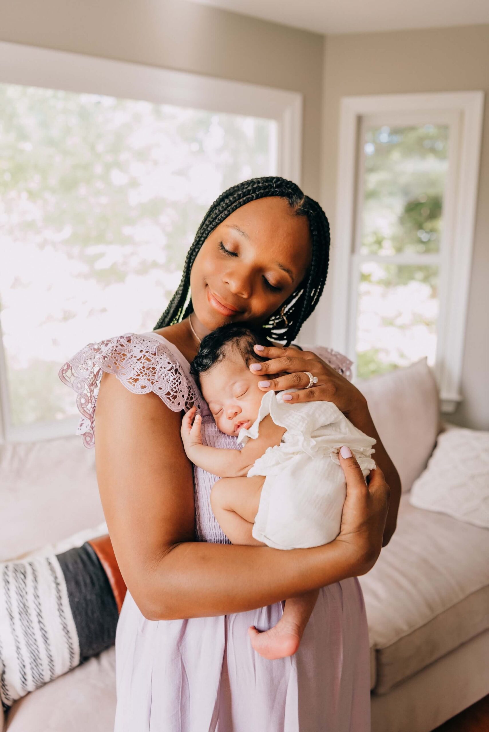 mother snuggles her baby during her photos with Boston Newborn Photographer, Allison Wolf