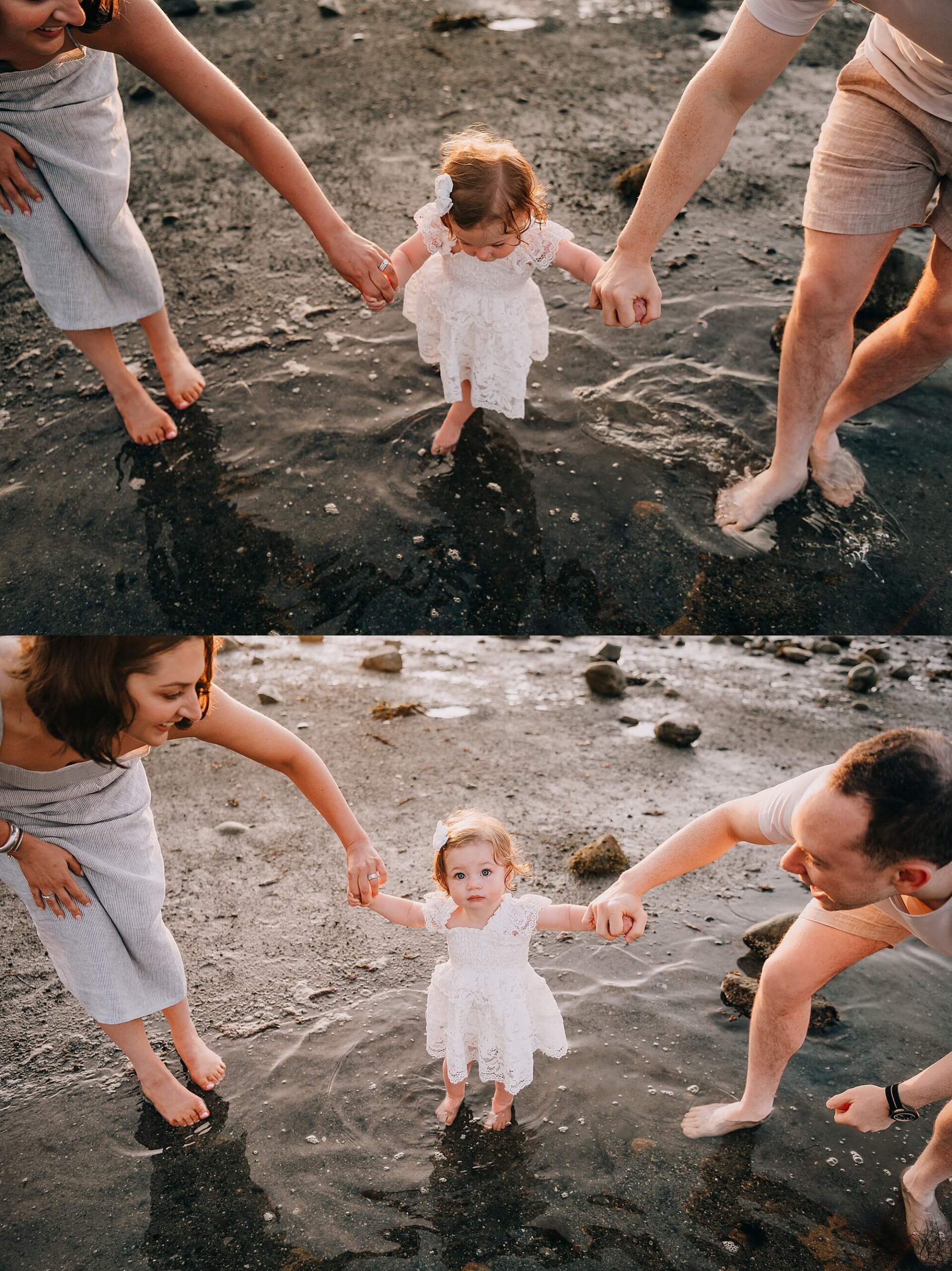 toddler getting her feet wet in the bay by Scituate lighthouse
