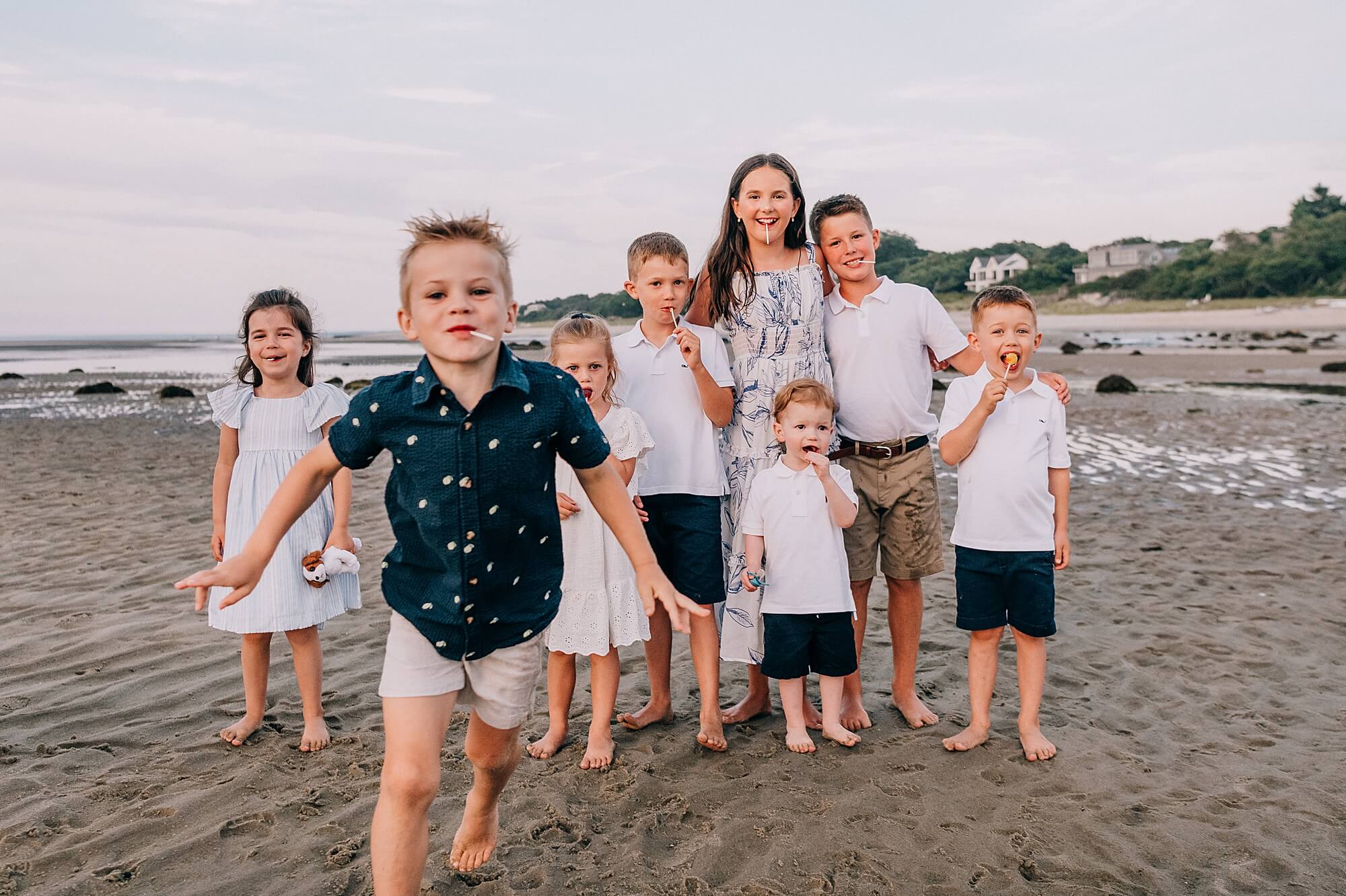 A group of cousins being silly during their Cape Cod family photoshoot