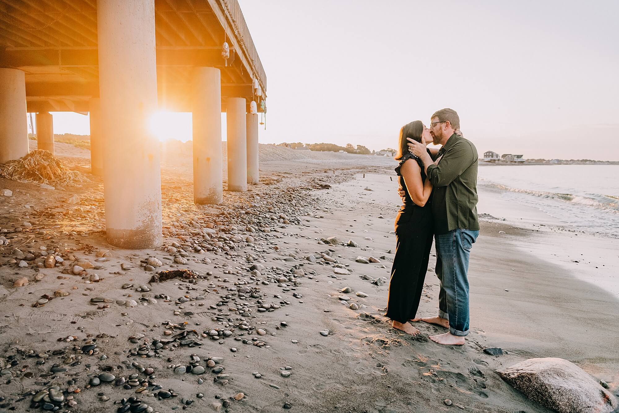 A couple kisses during sunset at Egypt Beach during photos with Scituate MA Family photographer Allison Wolf