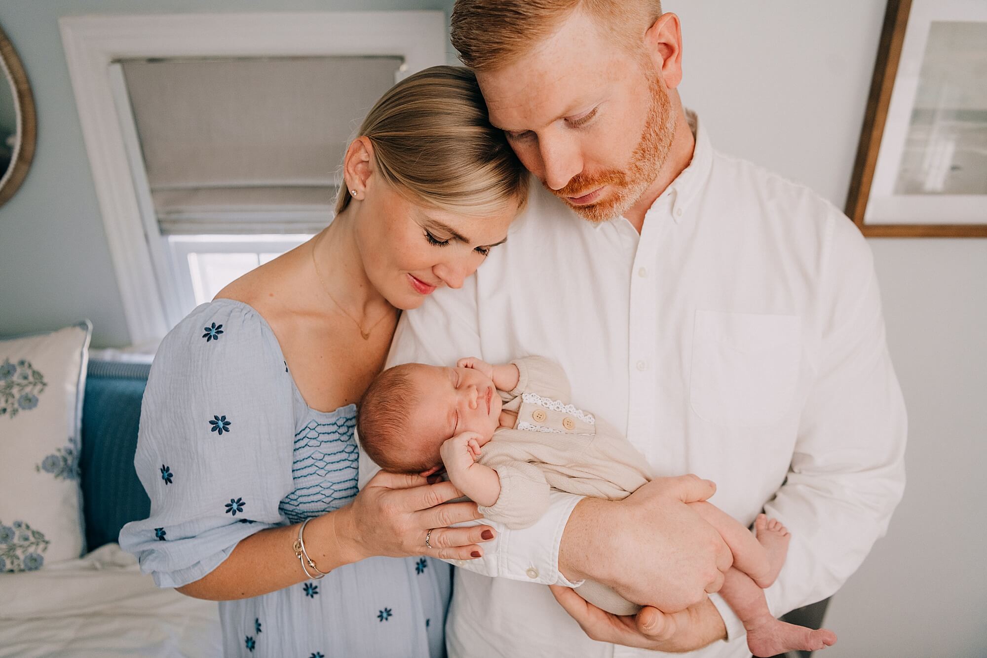A mother and father hold their newborn baby girl during their session with South Shore MA Newborn Photographer, Allison Wolf