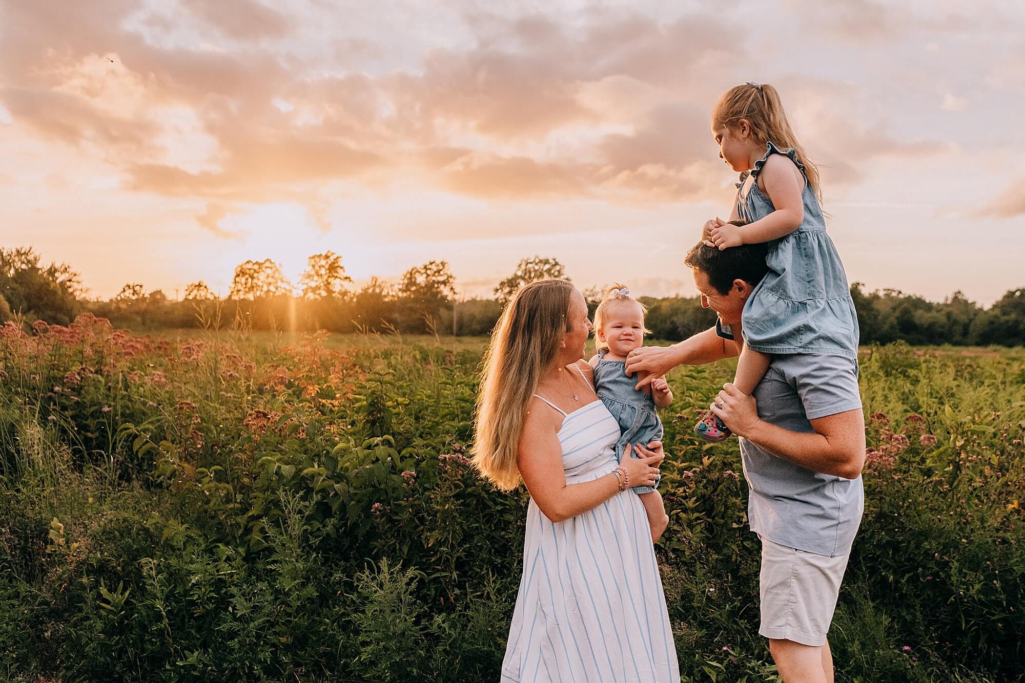 Family session at sunset in Duxbury MA with wildflowers South Shore family photographer